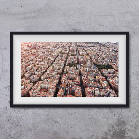 Blocks of Barcelona with Sagrada Familia seen from the air